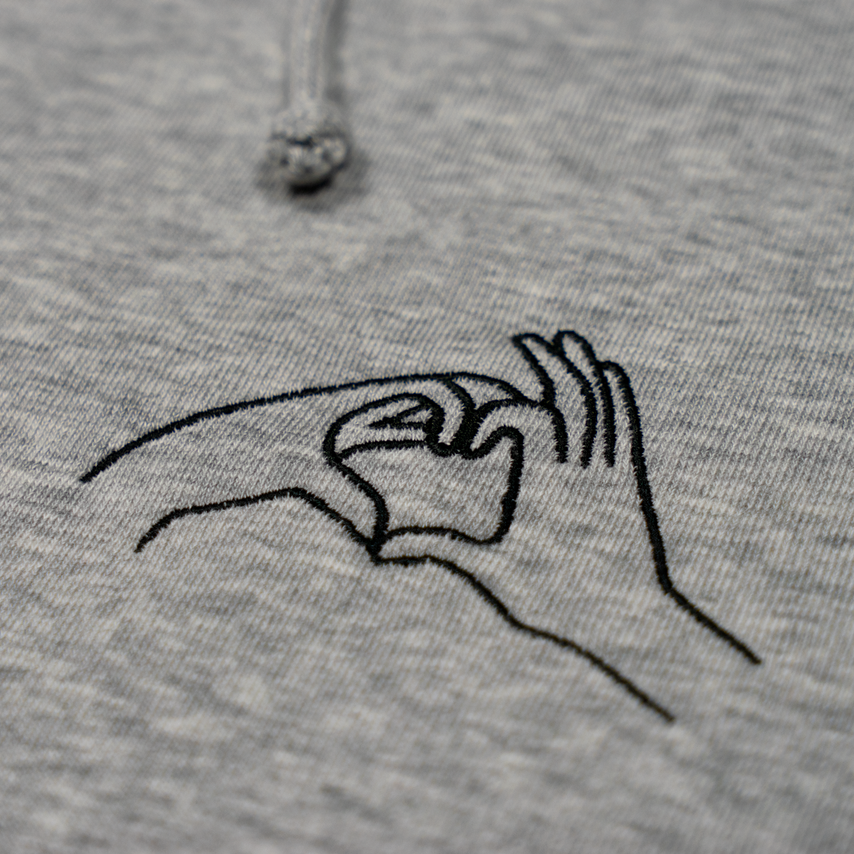 Sweat à capuche avec cœur et mains